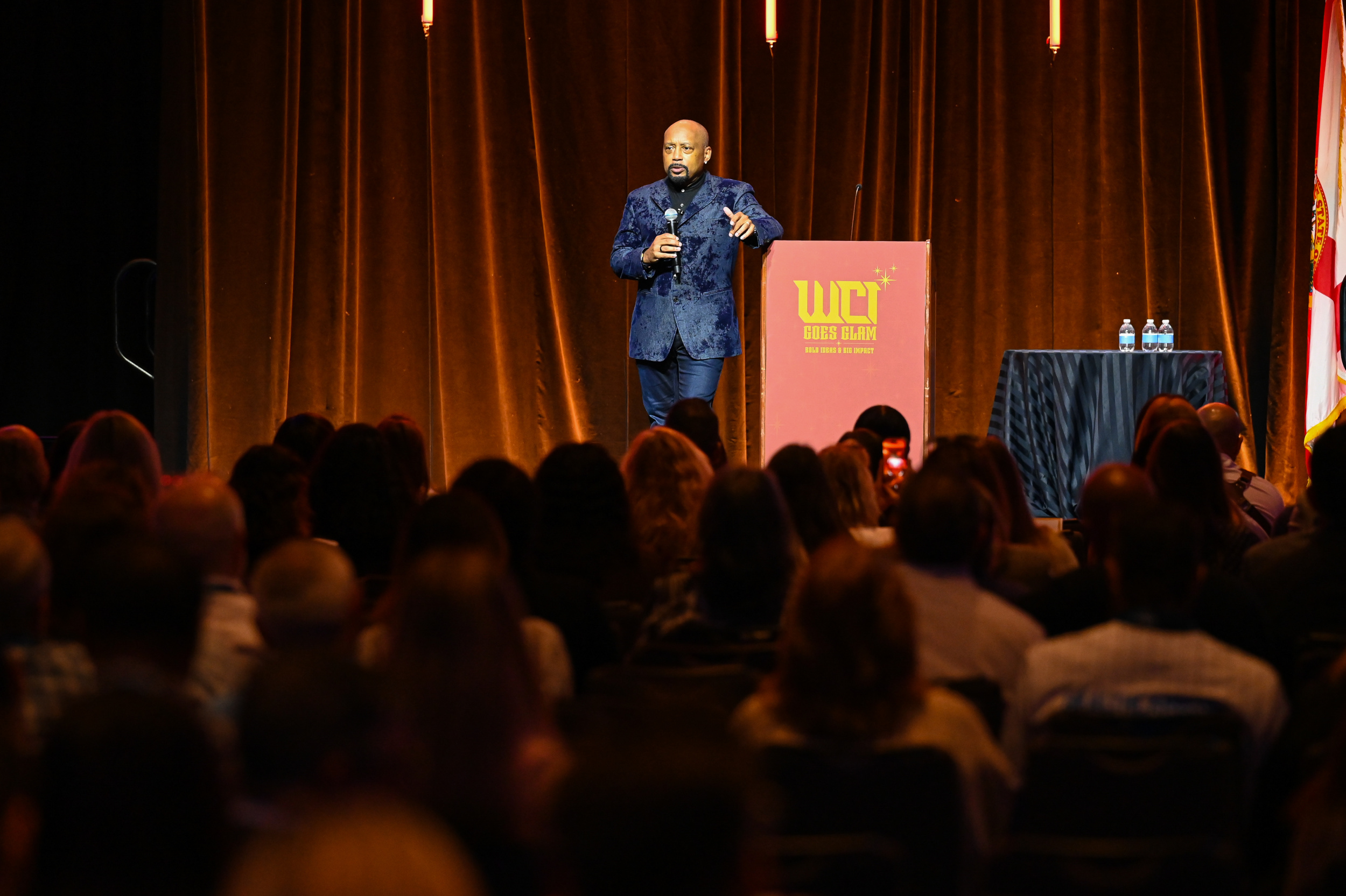 Daymond John speaking to attendees at the WCI 2026 Conference